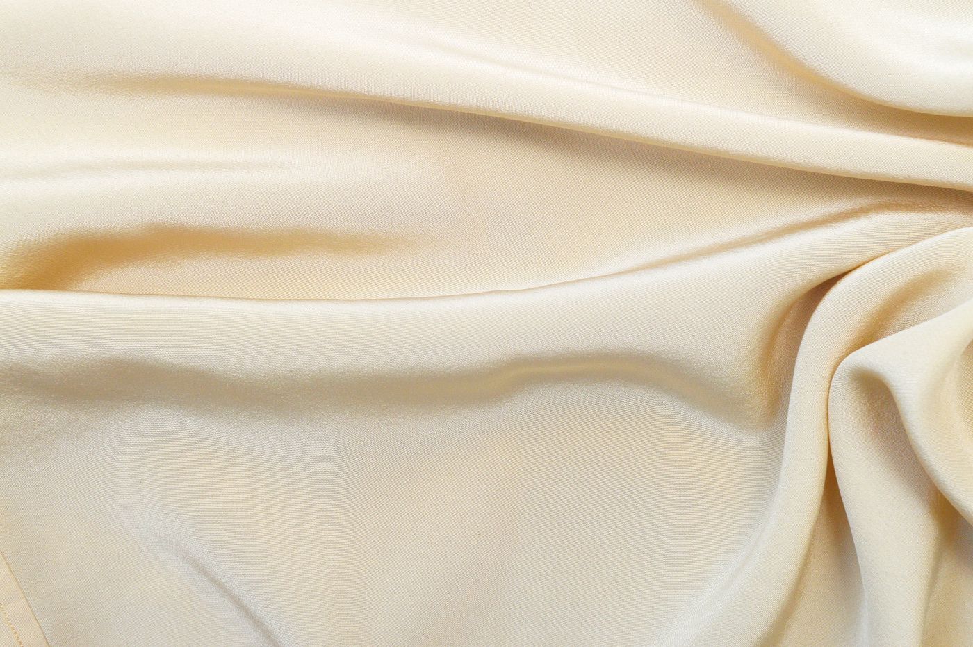 Cream silk fabric, draped and photographed close